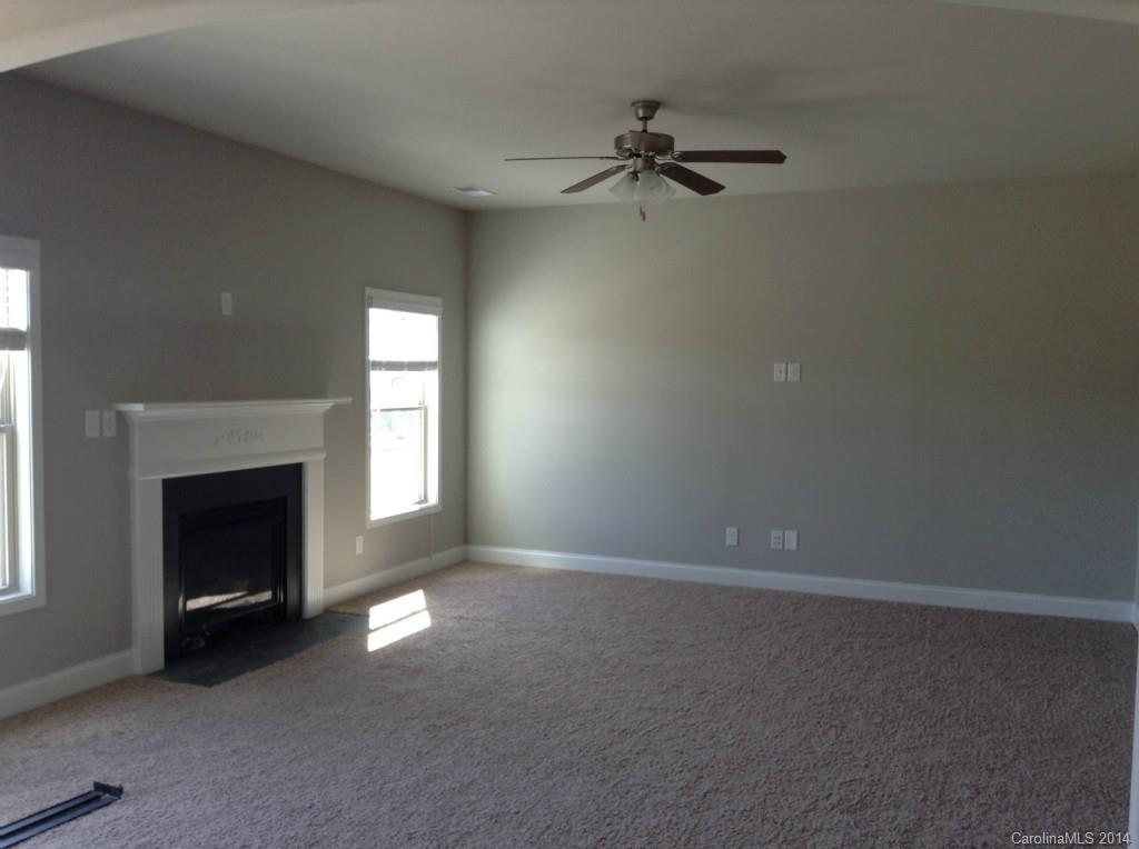1007 Potomac Road, Unit AD109 Indian Trail, NC 28079 - Photo 3 of 6 a view of empty room with a fireplace