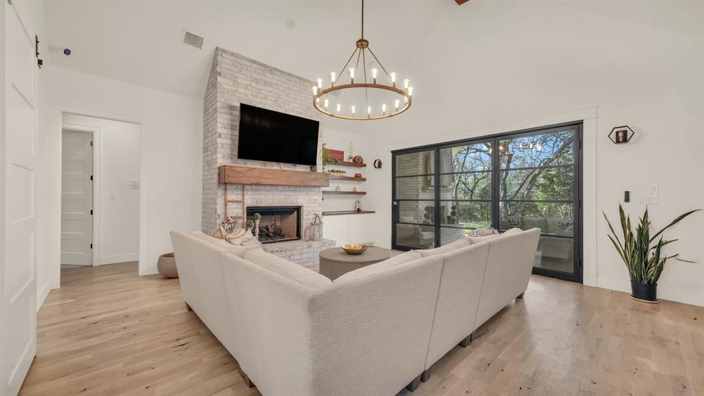 374 Glade Valley Road Azle, TX 76020 - Photo 12 of 38 a living room with fireplace furniture and a flat screen tv
