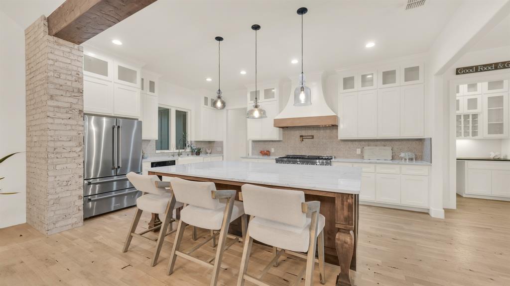 374 Glade Valley Road Azle, TX 76020 - Photo 16 of 38 a kitchen with stainless steel appliances granite countertop a stove a sink a refrigerator and a island