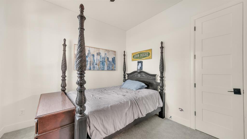 374 Glade Valley Road Azle, TX 76020 - Photo 31 of 38 a bedroom with a bed and cabinets