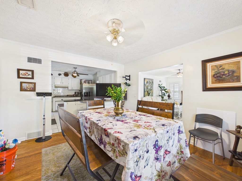 1608 39th Street Columbus, GA 31904 - Photo 11 of 63 a view of a dining room with furniture and wooden floor