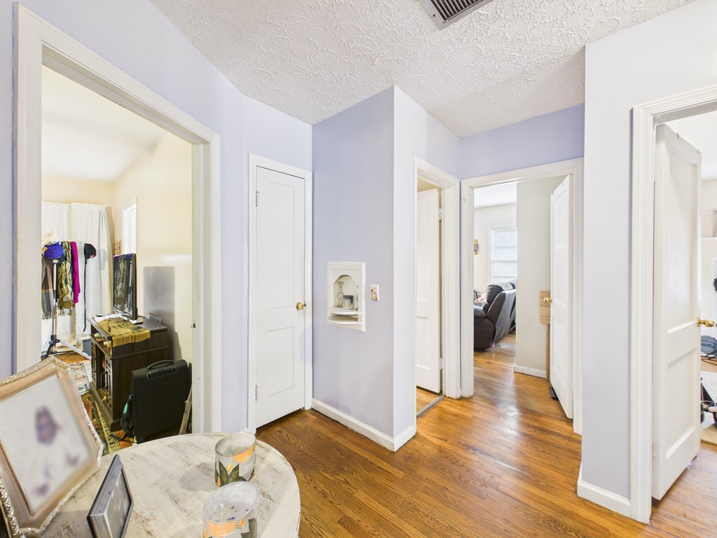 1608 39th Street Columbus, GA 31904 - Photo 24 of 63 a view of a livingroom with wooden floor and bedroom space