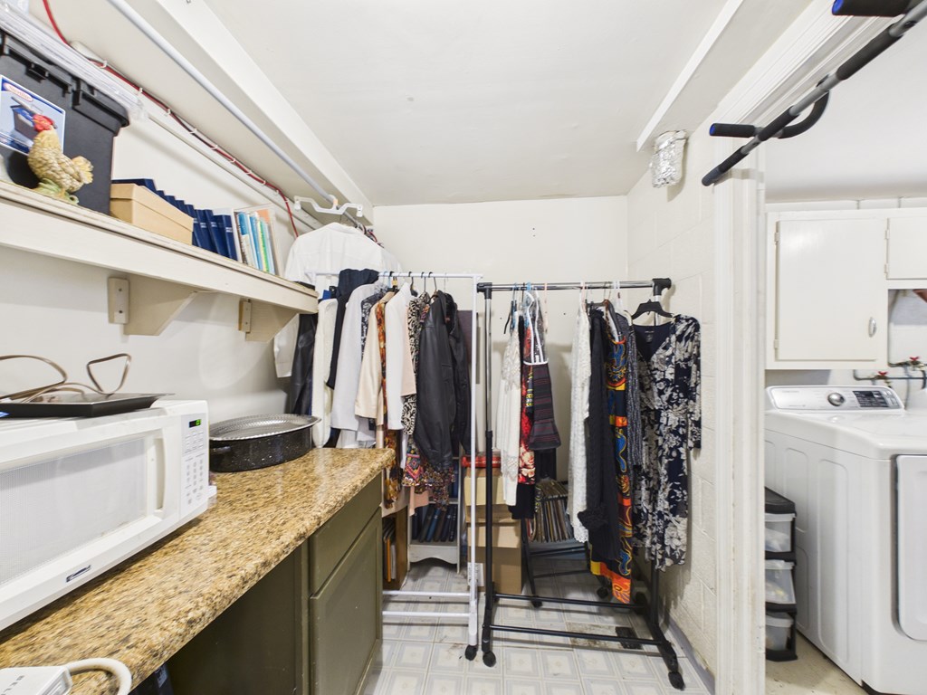 1608 39th Street Columbus, GA 31904 - Photo 39 of 63 a view of walk in closet with clothes and shoes