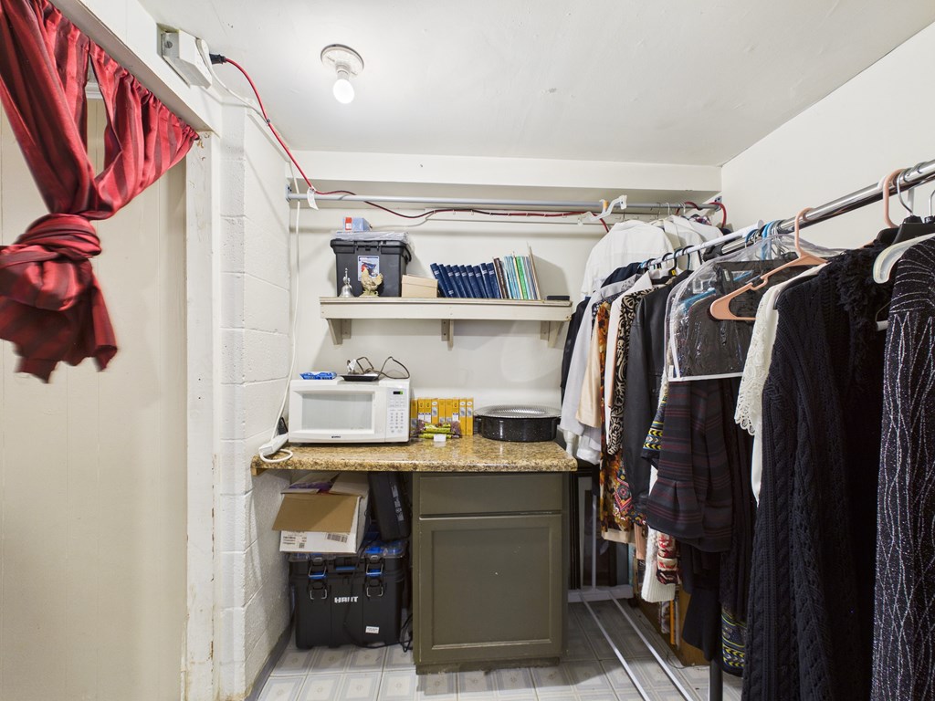 1608 39th Street Columbus, GA 31904 - Photo 40 of 63 a view of walk in closet with clothes and shoes