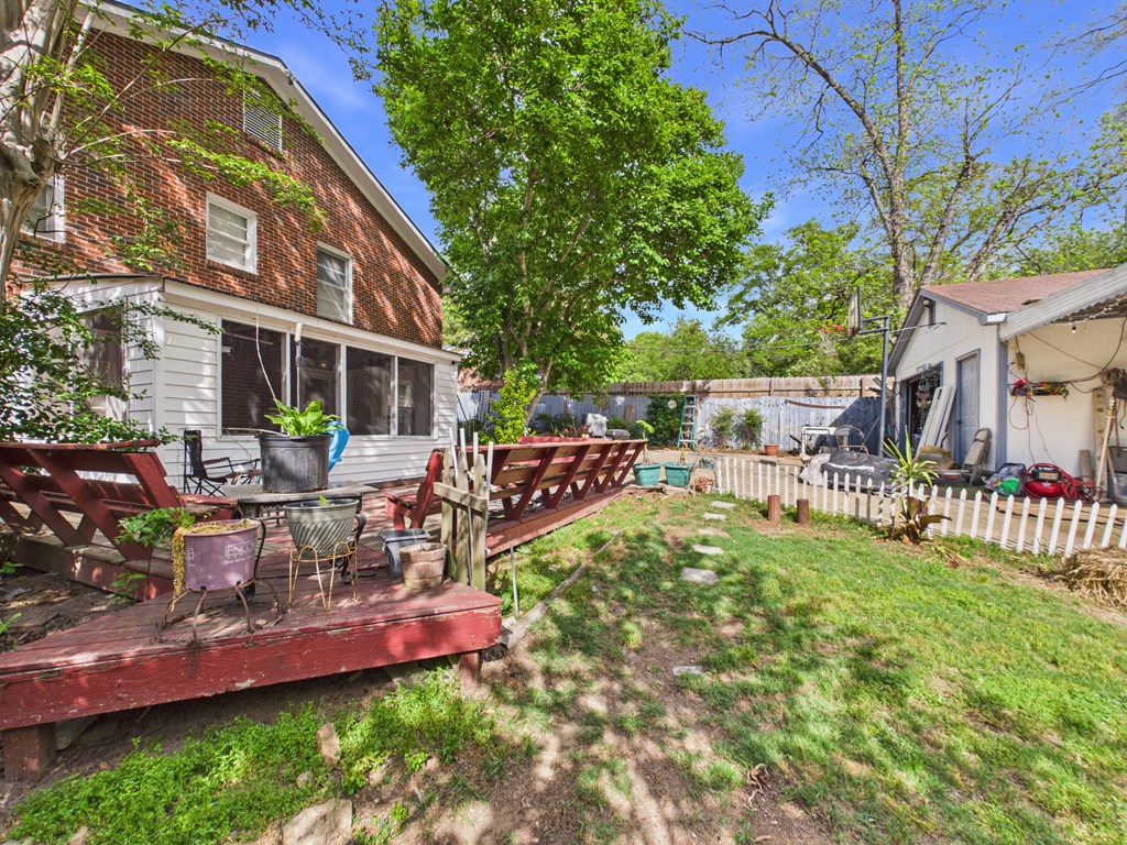 1608 39th Street Columbus, GA 31904 - Photo 49 of 63 a view of a house with backyard sitting area and garden