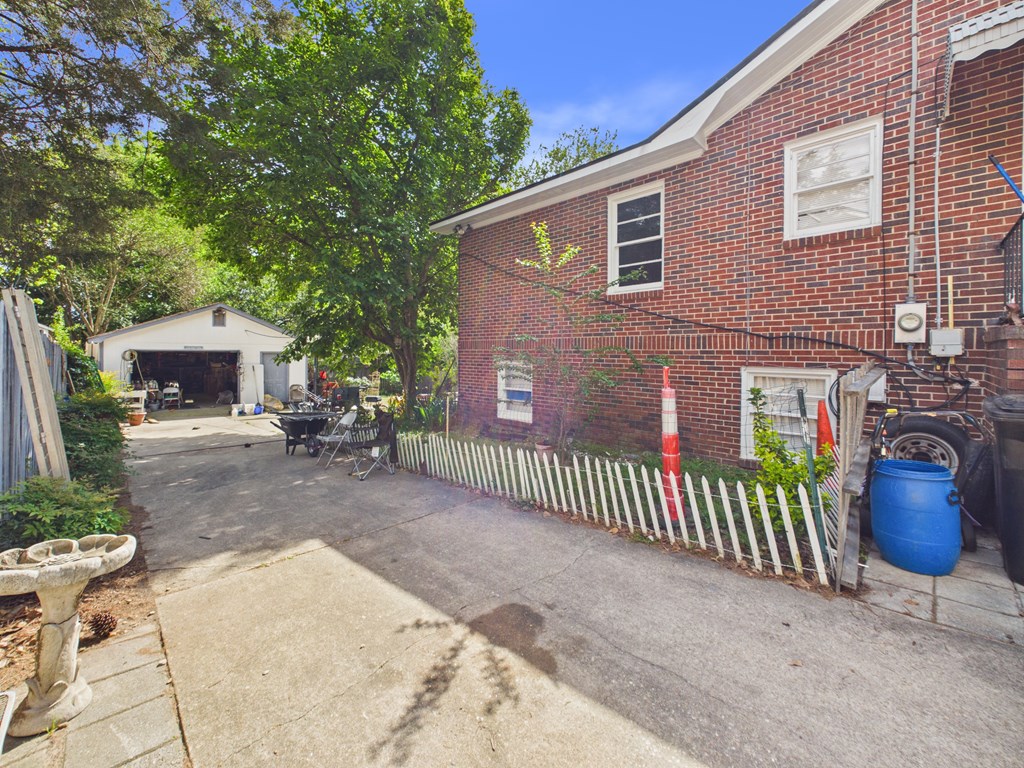 1608 39th Street Columbus, GA 31904 - Photo 51 of 63 a view of house with backyard and a patio