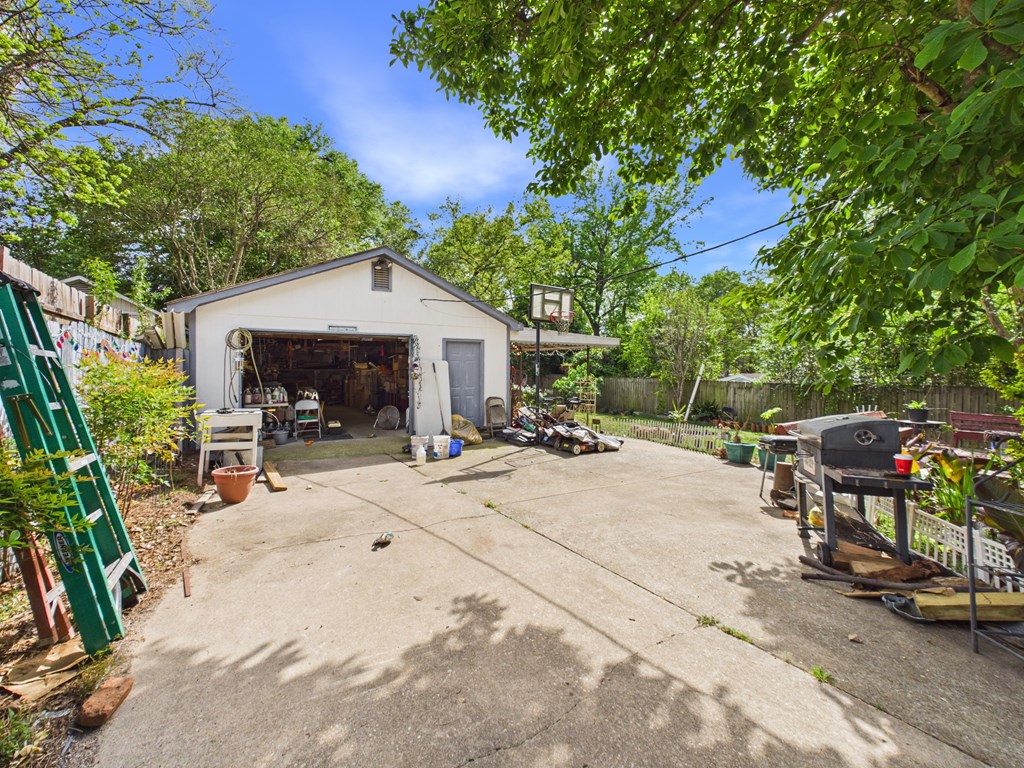 1608 39th Street Columbus, GA 31904 - Photo 53 of 63 a view of a patio with table and chairs under an umbrella