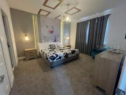 a bedroom with furniture and a window