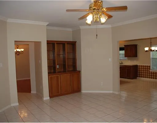 a kitchen with stainless steel appliances granite countertop a sink and a refrigerator