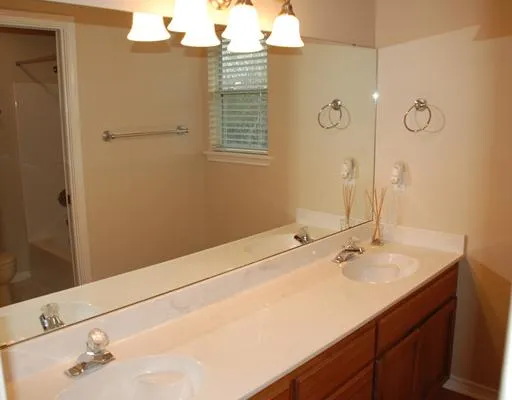 a vase of flowers sitting on a floor