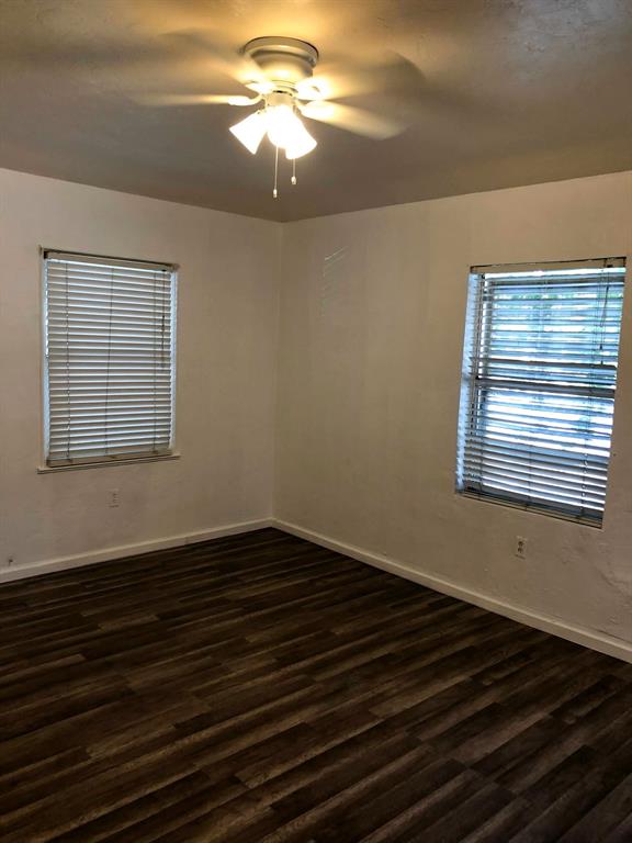 2000 Polk Street Hollywood, FL 33020 - Photo 6 of 7 a view of an empty room with wooden floor and a window