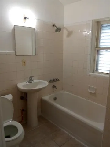a bathroom with a sink toilet and bathtub