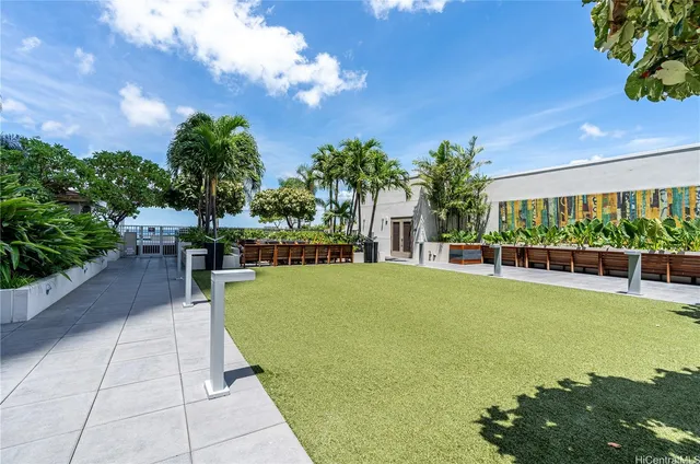 a view of swimming pool with outdoor seating and plants