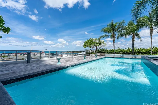a view of a swimming pool with an outdoor space and seating area