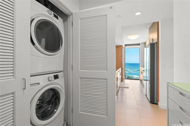 a view of a hallway with washer and dryer
