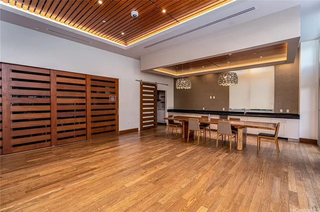 a room with wooden furniture and a table