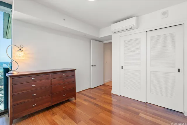 a room with a dresser and a mirror