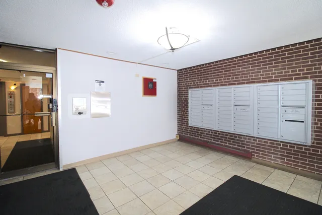 a view of a utility room with wooden floor