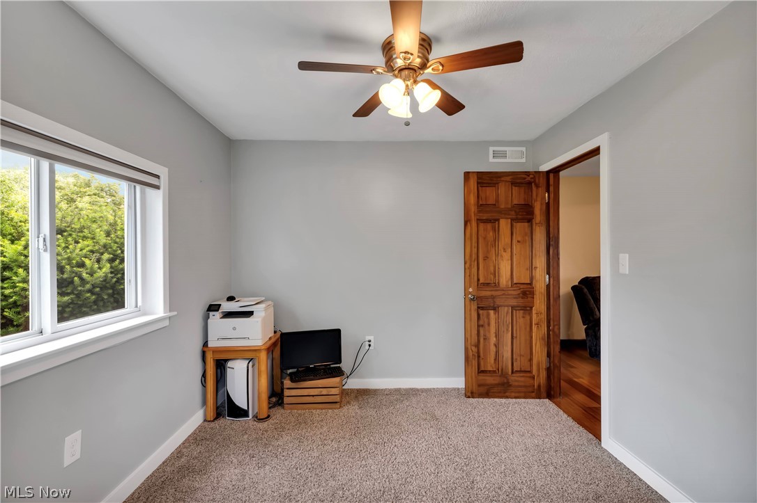 8704 Columbia Road Olmsted Falls, OH 44138 - Photo 24 of 34 bedroom with gray walls,plush carpet, and wooden door