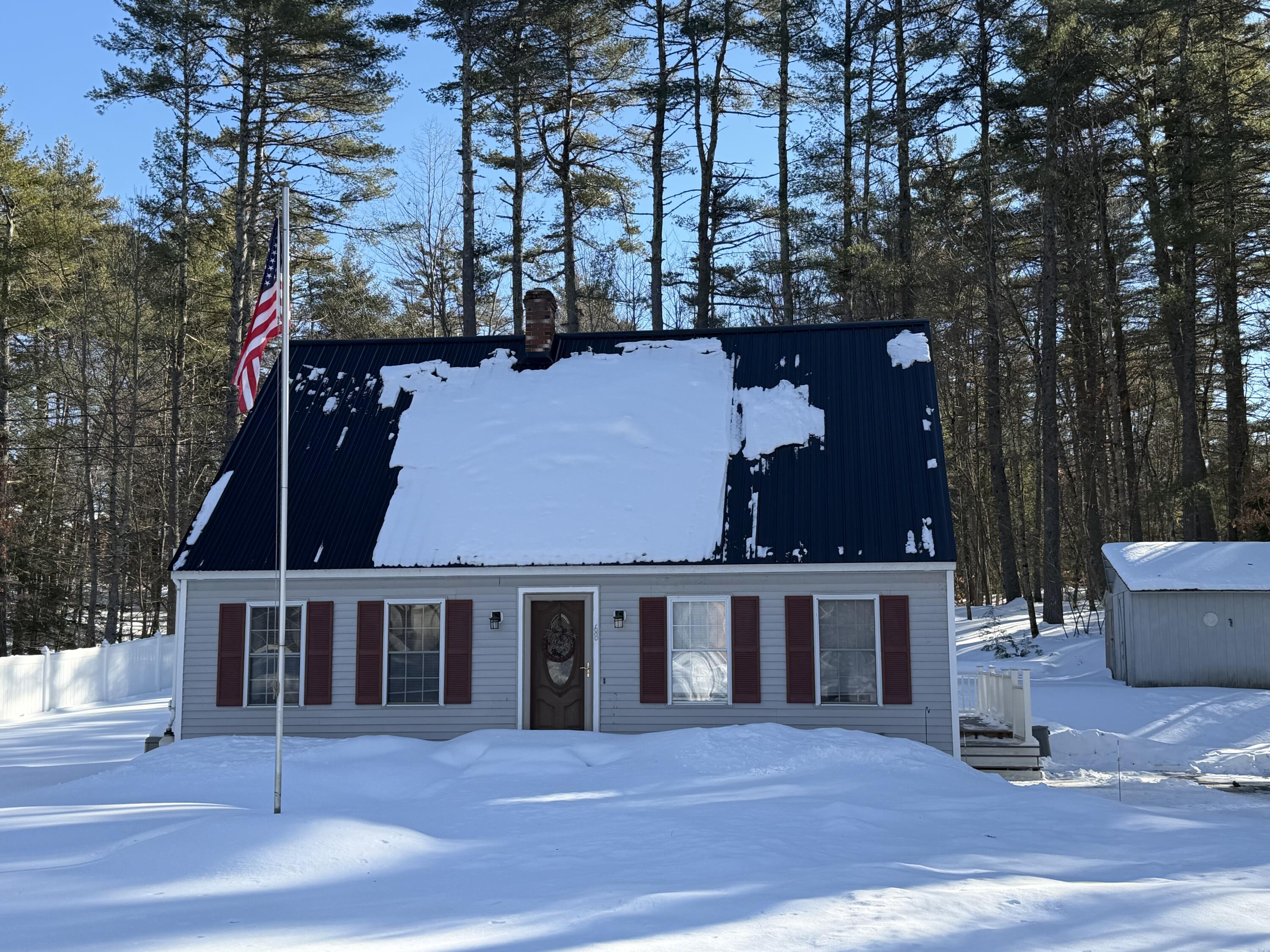 Front, w/beautiful grass in the summer