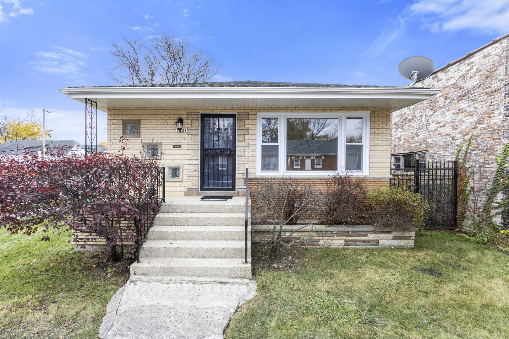 1901 West 71st Street Chicago, IL 60636 - Photo 1 of 25 a front view of a house with a yard