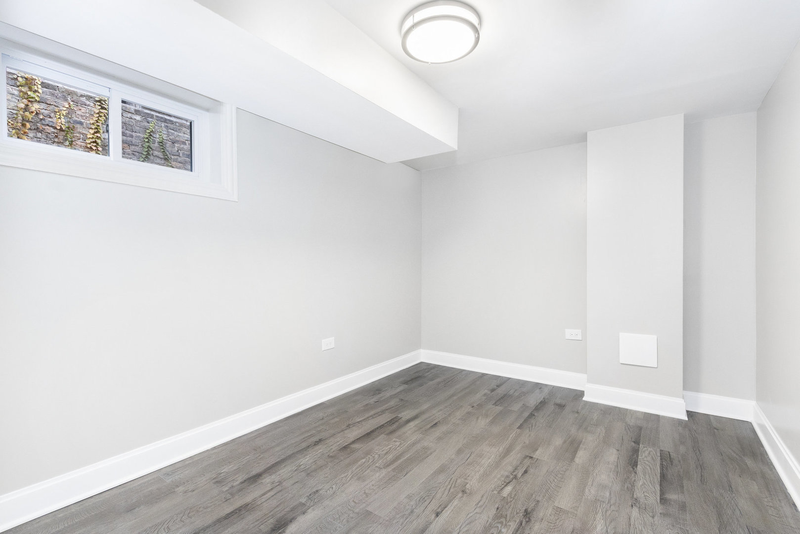 1901 West 71st Street Chicago, IL 60636 - Photo 16 of 25 a view of a room with wooden floor and white walls