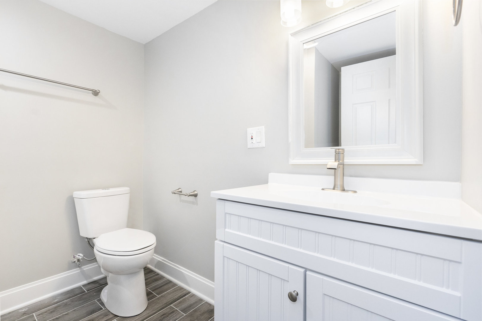 1901 West 71st Street Chicago, IL 60636 - Photo 17 of 25 a bathroom with a toilet sink and mirror