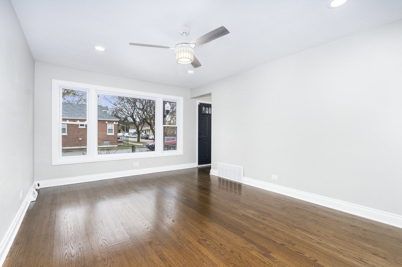 1901 West 71st Street Chicago, IL 60636 - Photo 2 of 25 wooden floor in an empty room with a window