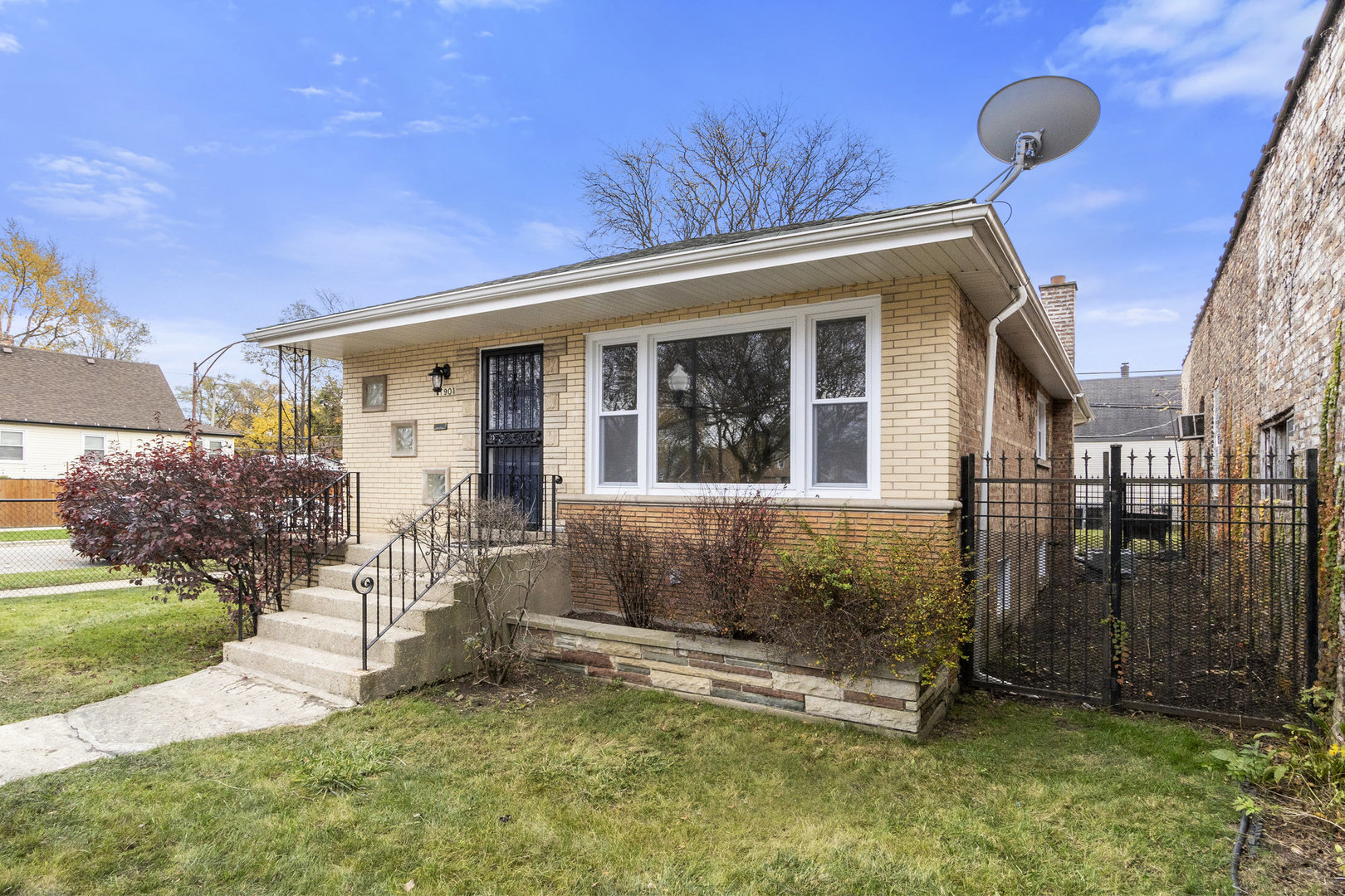 1901 West 71st Street Chicago, IL 60636 - Photo 22 of 25 a front view of a house with a yard
