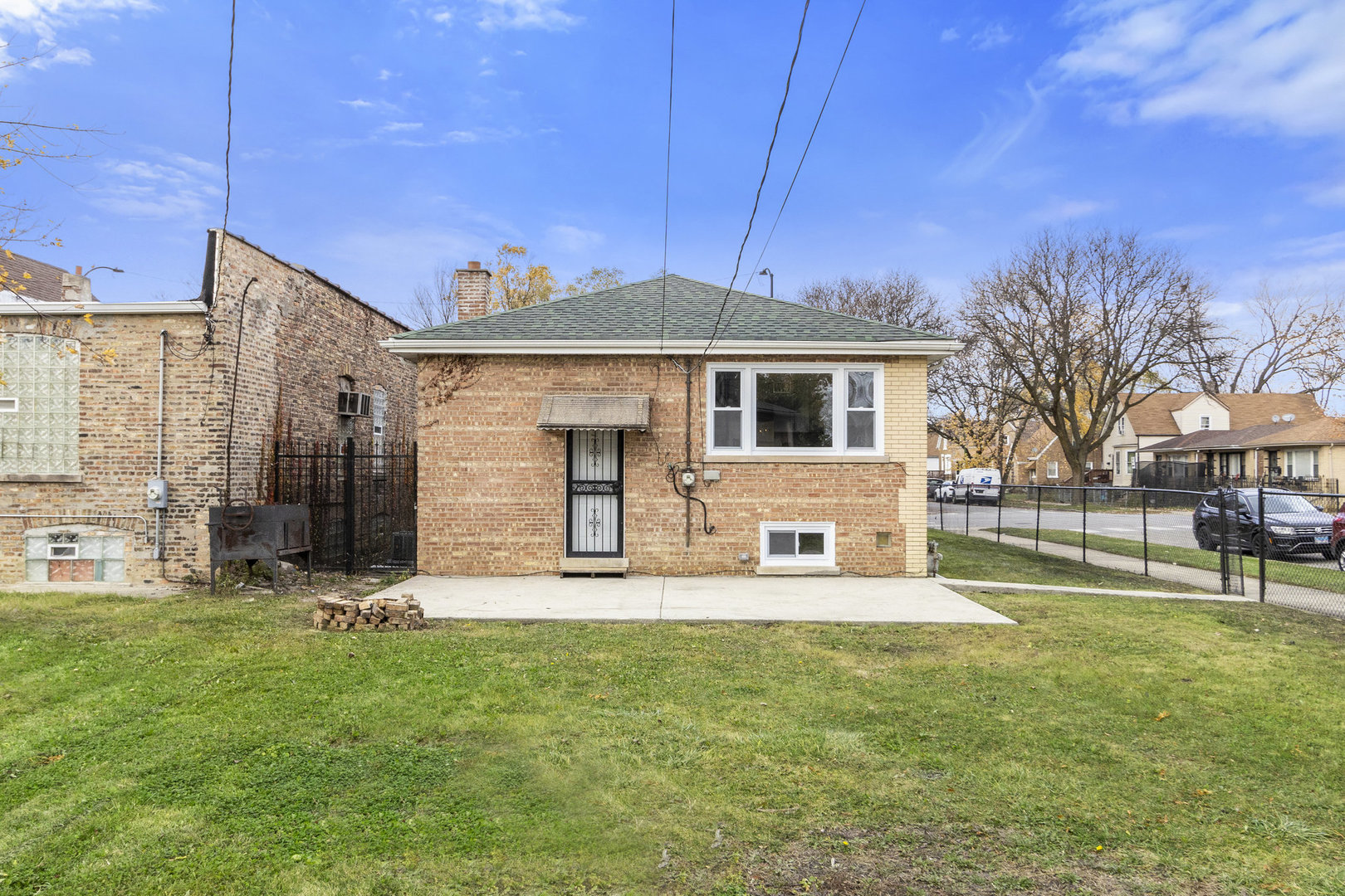 1901 West 71st Street Chicago, IL 60636 - Photo 23 of 25 a front view of a house with a yard
