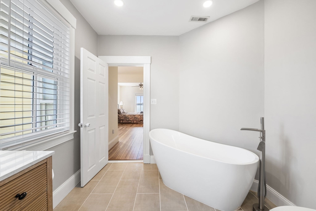 90 Puritan Road Swampscott, MA 01907 - Photo 25 of 42 a bathroom with a bathtub and a shower