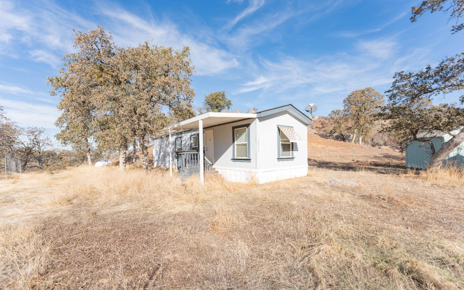 40778 Iris Road Squaw Valley, CA 93675 - Photo 2 of 44 a view of a house with a yard