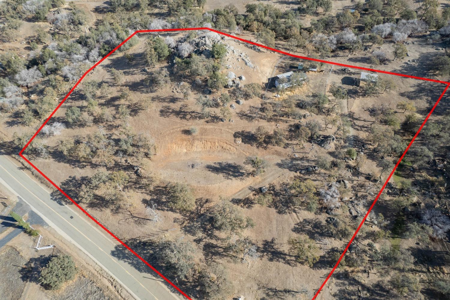 40778 Iris Road Squaw Valley, CA 93675 - Photo 44 of 44 a view of a dry yard with wooden fence and trees