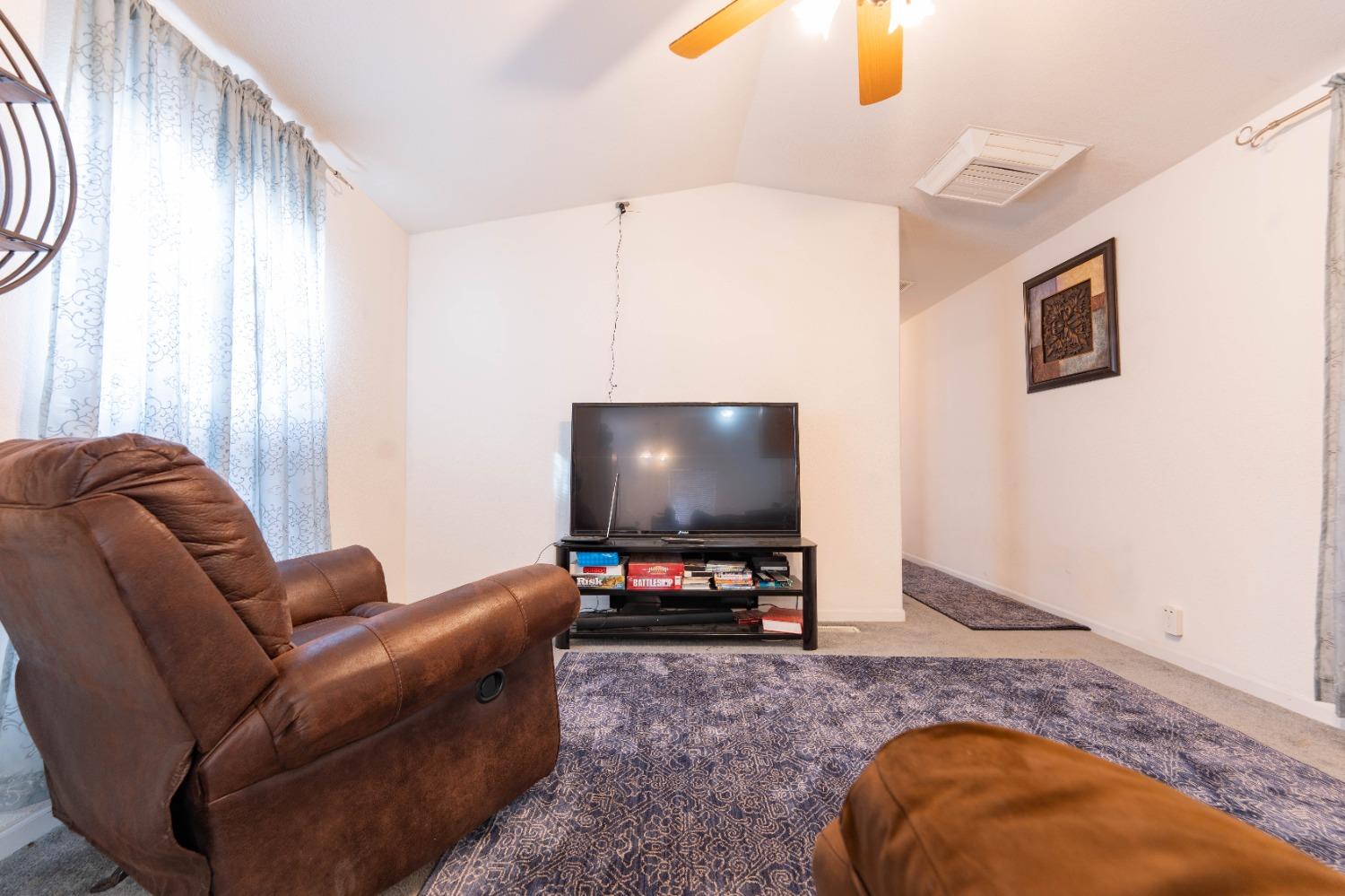 40778 Iris Road Squaw Valley, CA 93675 - Photo 8 of 44 a living room with furniture and a flat screen tv