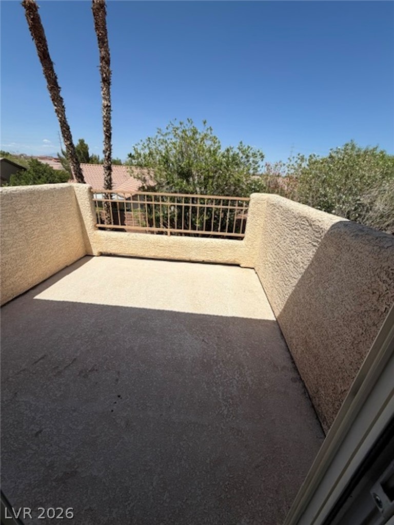 3862 Landing Ridge Place Las Vegas, NV 89135 - Photo 16 of 26 Enjoy views of verdant trees and neighboring rooftops from this private balcony.