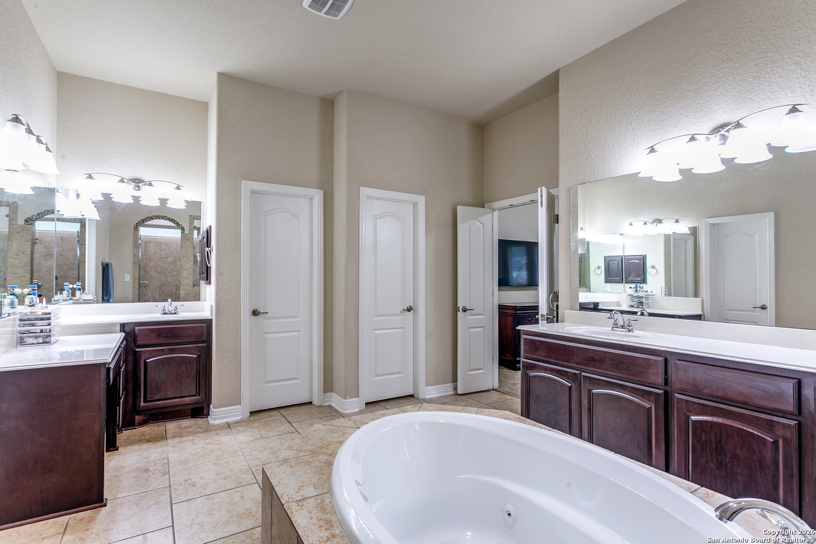 701 Morningside Drive Terrell Hills, TX 78209 - Photo 25 of 47 a spacious bathroom with a granite countertop sink mirror and shower