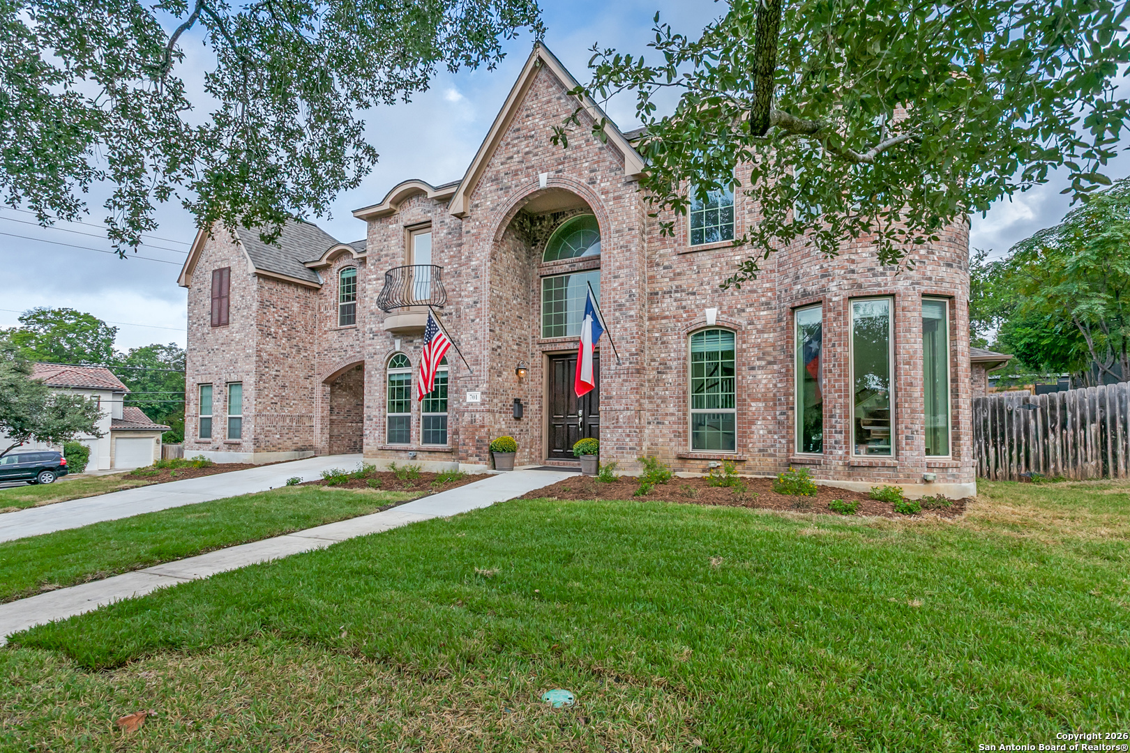 701 Morningside Drive Terrell Hills, TX 78209 - Photo 3 of 47 a front view of a house with a yard and large trees