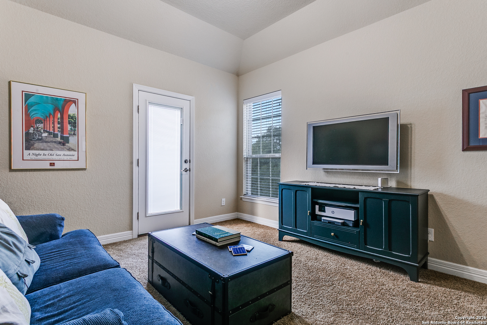 701 Morningside Drive Terrell Hills, TX 78209 - Photo 32 of 47 a living room with furniture a flat screen tv and kitchen view