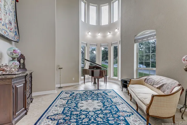 a view of a hallway with furniture and a rug