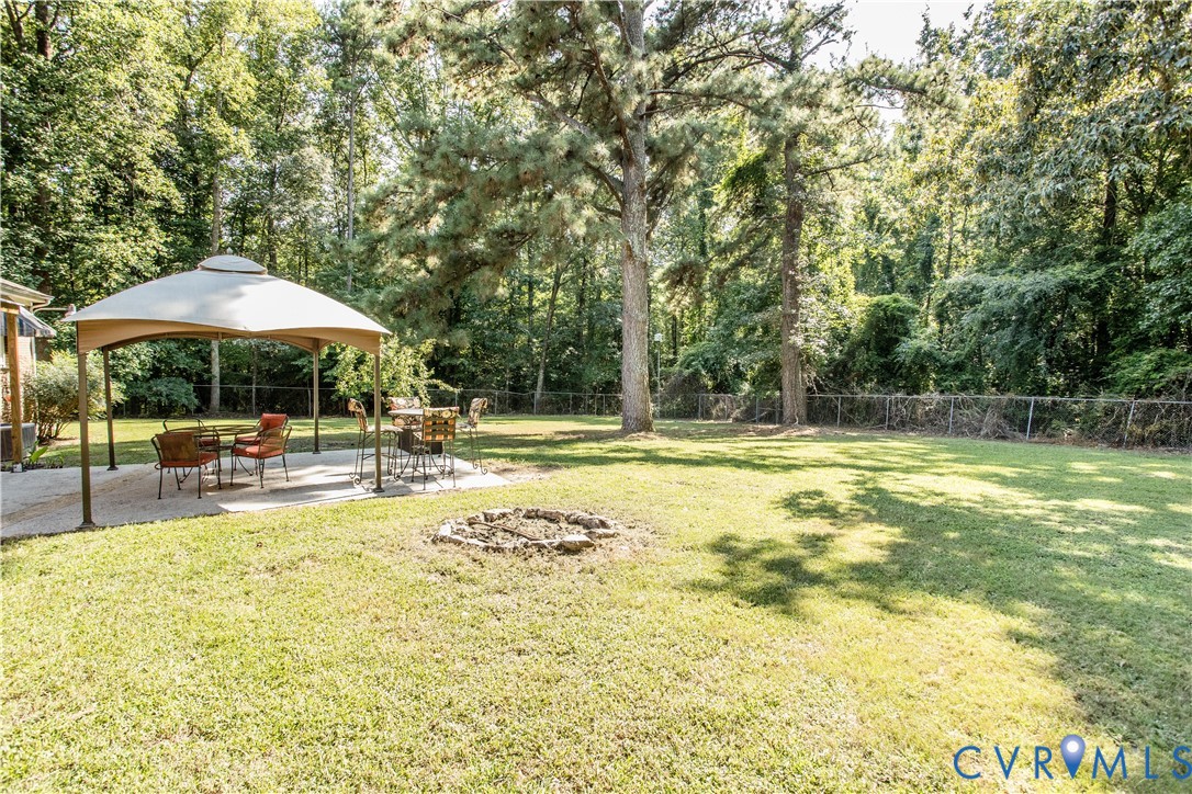 20808 Little Road Petersburg, VA 23803 - Photo 32 of 35 Expansive backyard featuring a large concrete pati