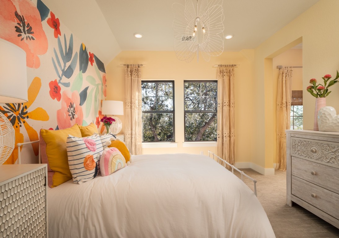 2002 Clearlight Lane Georgetown, TX 78633 - Photo 16 of 30 Carpeted bedroom with multiple windows, recessed lighting, and a chandelier