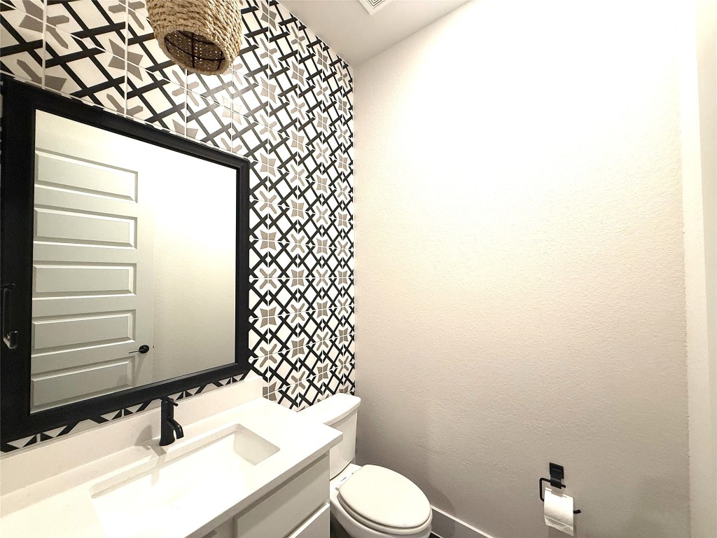 2002 Clearlight Lane Georgetown, TX 78633 - Photo 23 of 30 Half bathroom featuring vanity and toilet