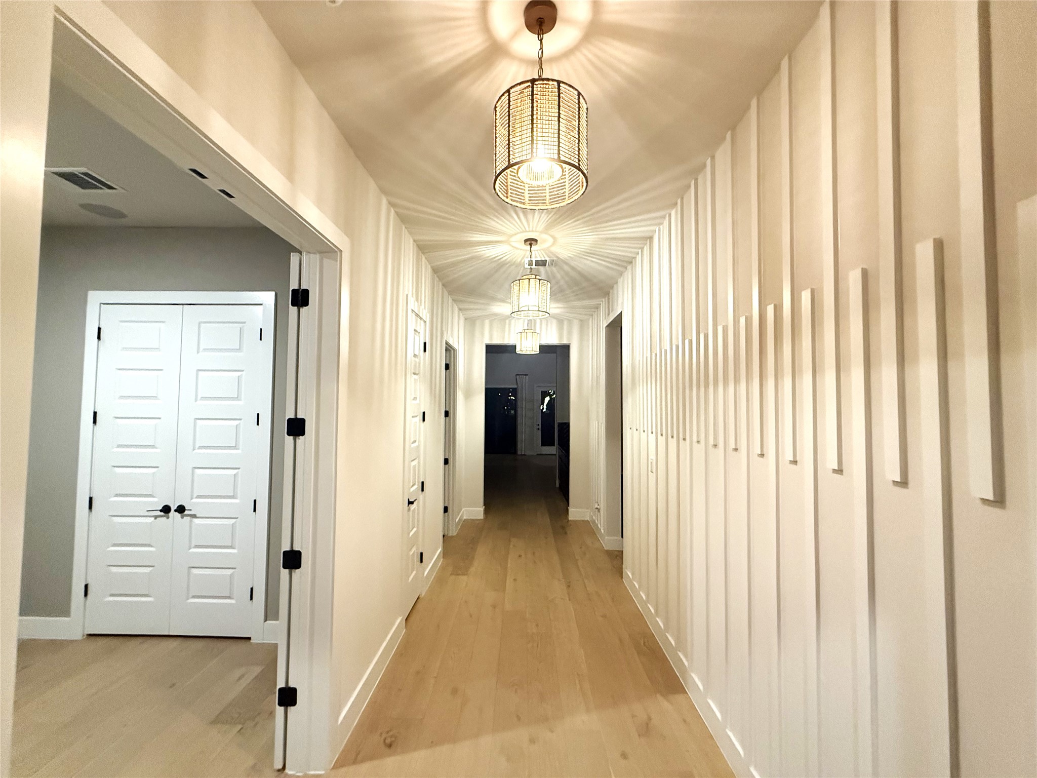 2002 Clearlight Lane Georgetown, TX 78633 - Photo 3 of 30 a view of a hallway with wooden floor and closet