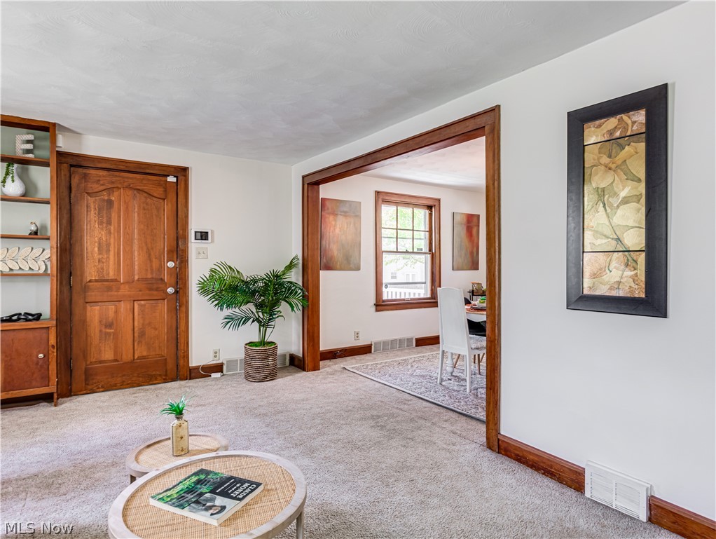 377 East Wilbeth Road Akron, OH 44301 - Photo 2 of 25 Living room with carpet.