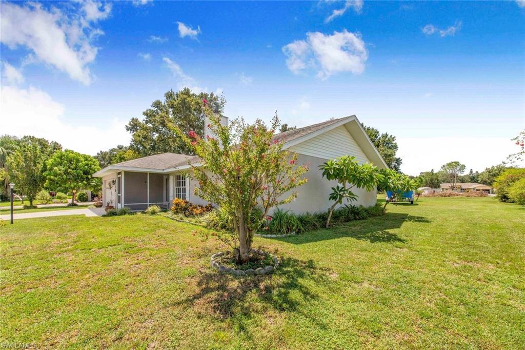 910 Liberty Lane Auburndale, FL 33823 - Photo 4 of 48 a front view of a house with a yard
