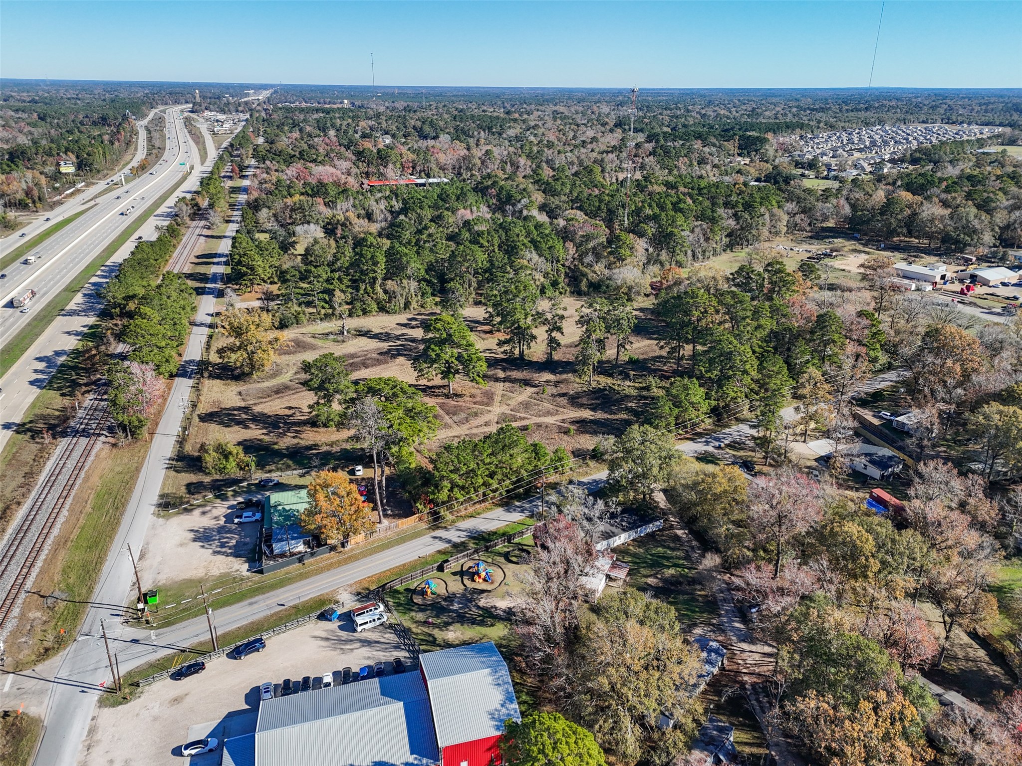 15633 1st Street Splendora, TX 77372 - Photo 3 of 19 an aerial view of a city