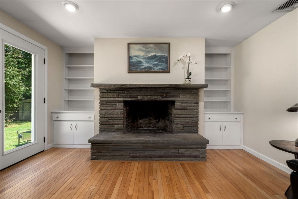 335 Conant Road Weston, MA 02493 - Photo 11 of 31 a living room with furniture and a fireplace