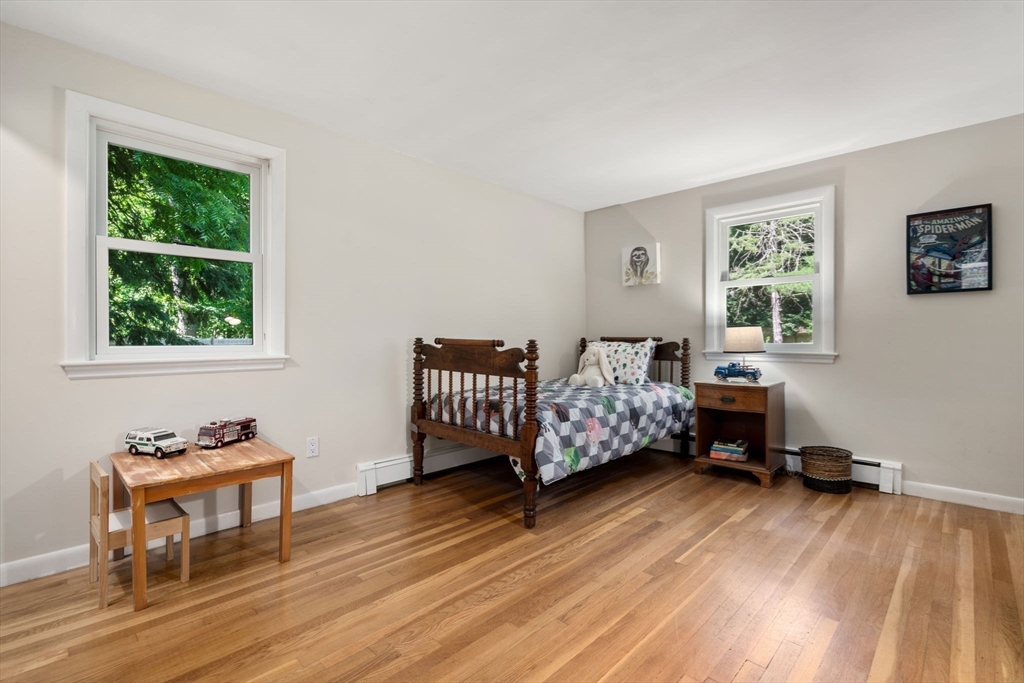 335 Conant Road Weston, MA 02493 - Photo 16 of 31 a bed room with furniture and a window