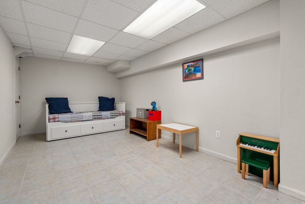 335 Conant Road Weston, MA 02493 - Photo 19 of 31 a living room with furniture and a table