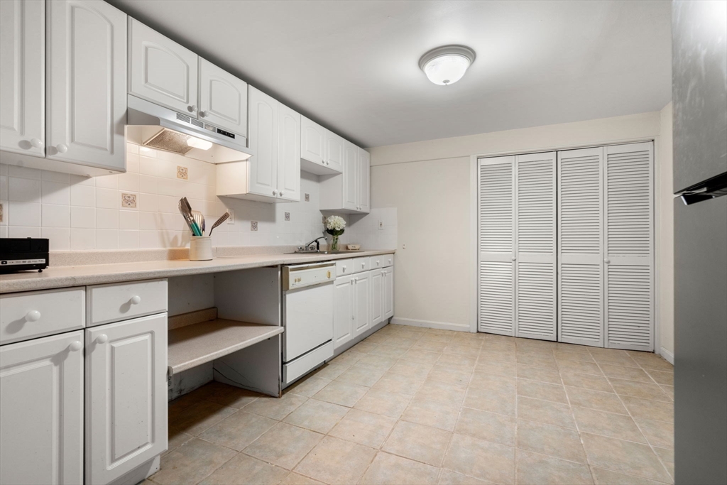 335 Conant Road Weston, MA 02493 - Photo 20 of 31 a utility room with cabinets
